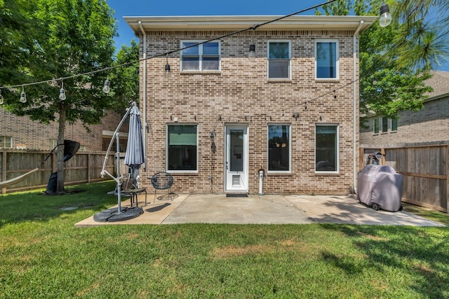 1267 Sopris Dr, Houston, TX 77077 - rear view of property featuring brick siding and a patio