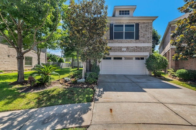 1267 Sopris Dr, Houston, TX 77077 - view of front of home with an attached garage, brick siding, and concrete driveway