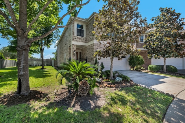 1267 Sopris Dr, Houston, TX 77077 - view of front facade featuring brick siding, driveway, and a garage