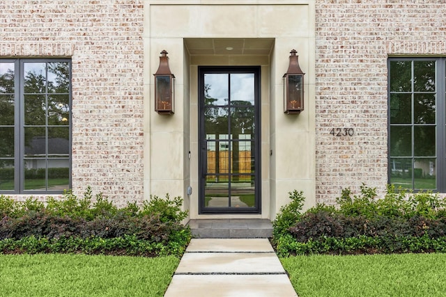 property entrance with brick siding