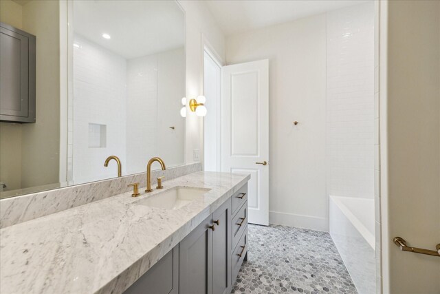 4230 Whitman St, Houston, TX 77027 - full bath featuring vanity, baseboards, a tub, recessed lighting, and a shower