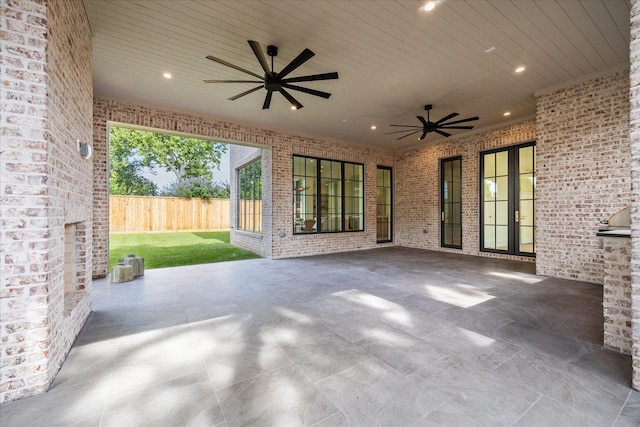 view of patio / terrace with fence and ceiling fan