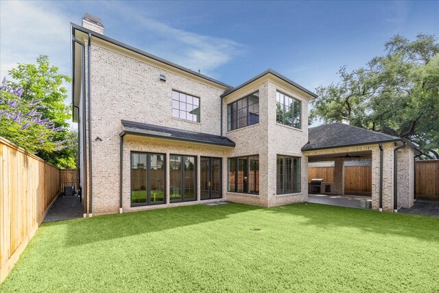 4230 Whitman St, Houston, TX 77027 - back of house featuring a patio area, brick siding, and a chimney