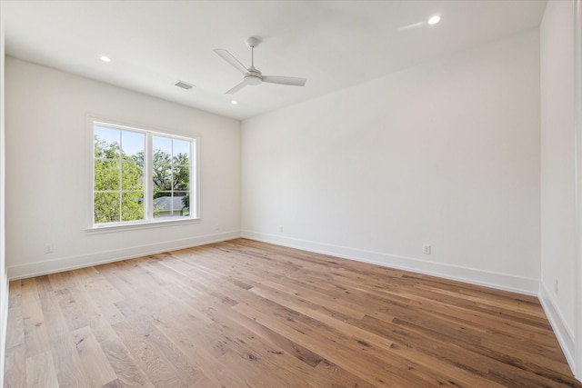 unfurnished room with baseboards, light wood-style flooring, a ceiling fan, and recessed lighting