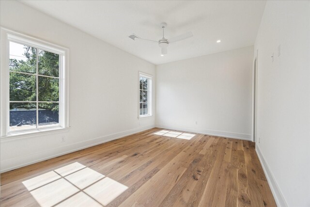 4230 Whitman St, Houston, TX 77027 - spare room featuring plenty of natural light, light wood finished floors, ceiling fan, and baseboards