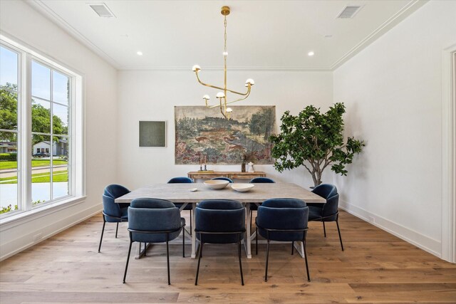 4230 Whitman St, Houston, TX 77027 - dining area with a chandelier, baseboards, crown molding, light wood-style flooring, and recessed lighting