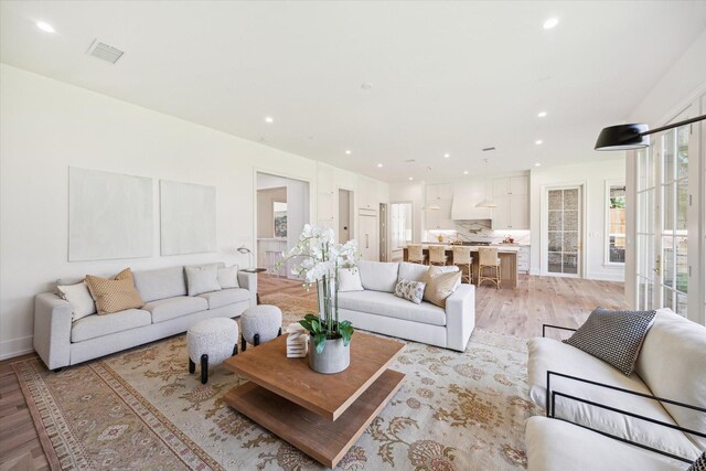 4230 Whitman St, Houston, TX 77027 - living room with light wood-type flooring, recessed lighting, and baseboards