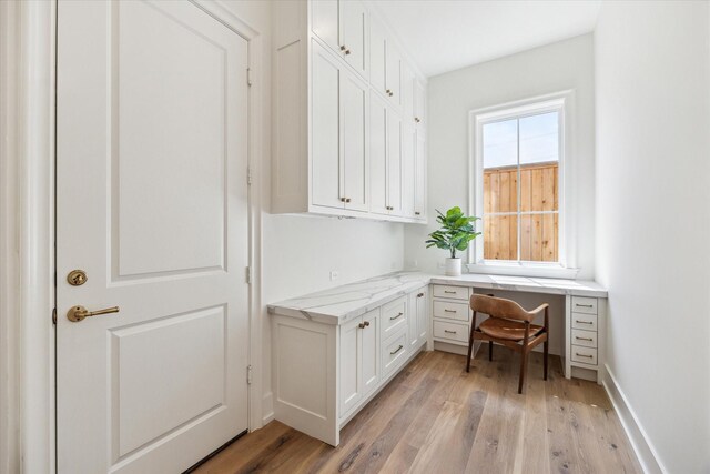4230 Whitman St, Houston, TX 77027 - office area with light wood-style floors and built in desk