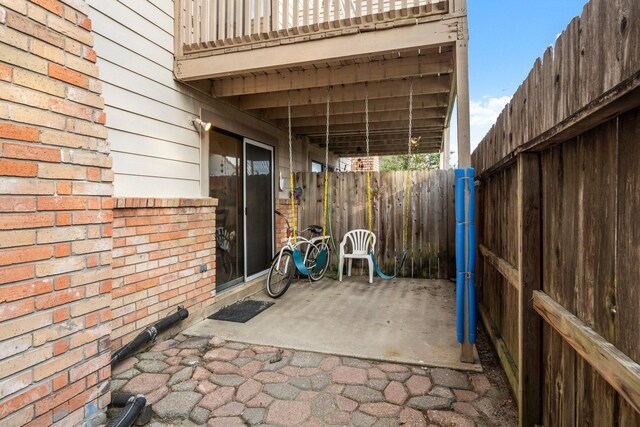 view of patio / terrace featuring fence