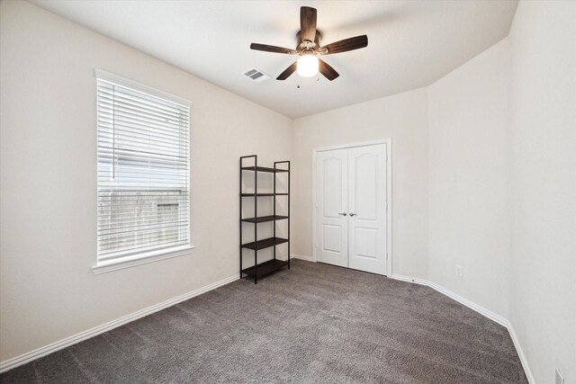 13347 Pecan Trails Dr, Santa Fe, TX 77510 - carpeted spare room with visible vents, a ceiling fan, and baseboards