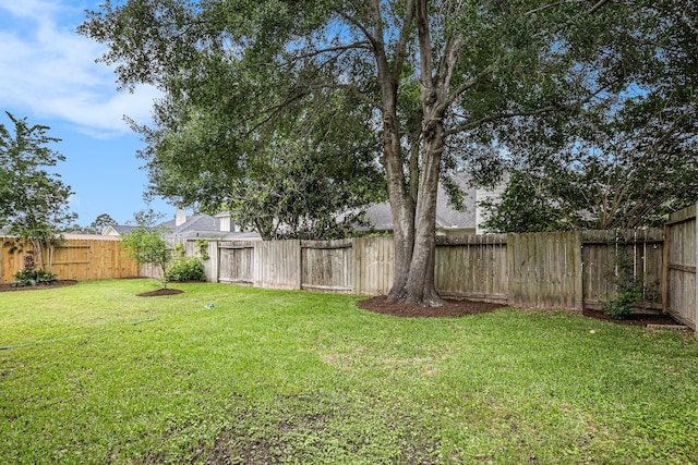 view of yard featuring a fenced backyard