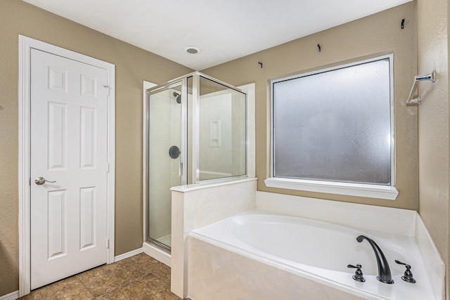 full bath with a bath and a stall shower