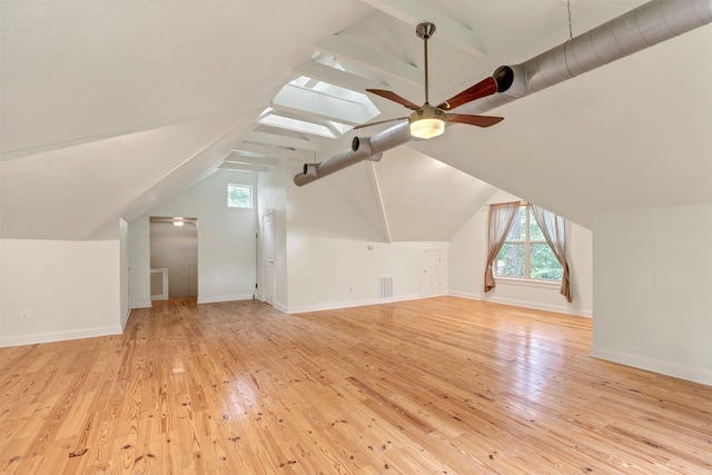 bonus room featuring plenty of natural light, a ceiling fan, and light wood-type flooring