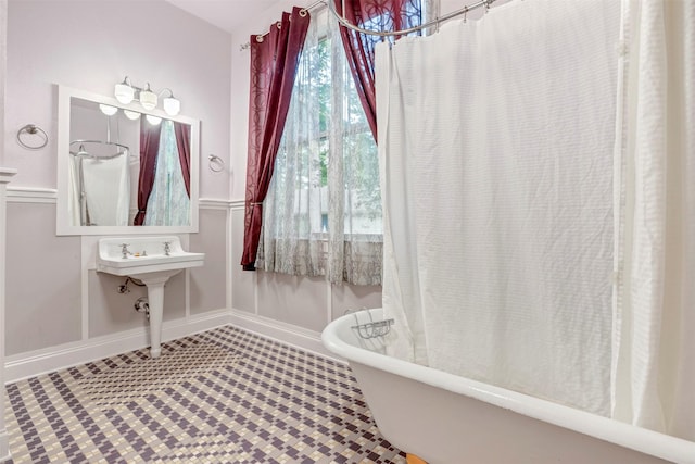 11958 White Oak Path, Conroe, TX 77385 - full bath with a freestanding bath, baseboards, and a shower with shower curtain
