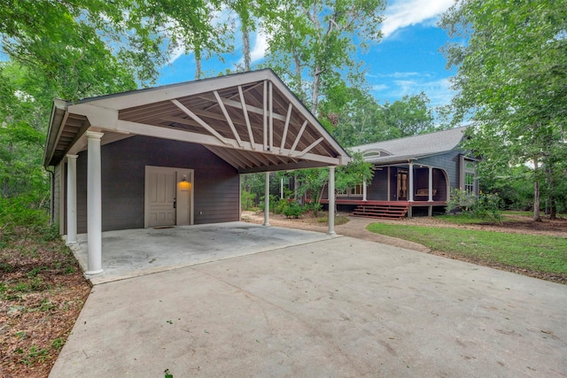 view of front of property with driveway and a wooden deck