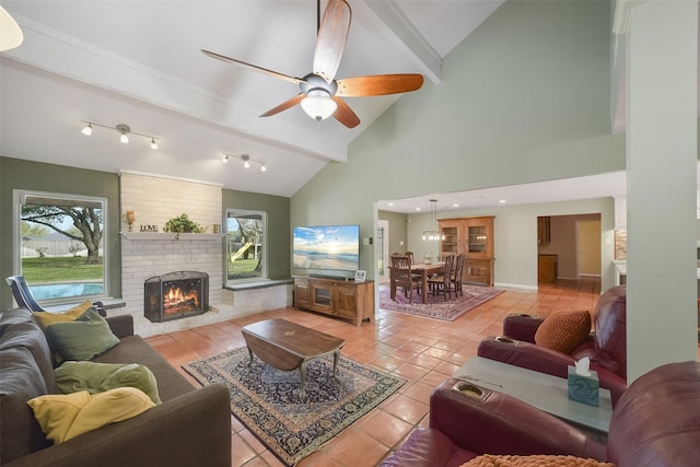 2711 N Saddlebrook Ln, Katy, TX 77494 - living area featuring beam ceiling, ceiling fan, a healthy amount of sunlight, and light tile patterned floors