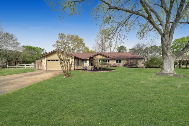 2711 N Saddlebrook Ln, Katy, TX 77494 - ranch-style house featuring fence, stone siding, a front yard, an attached garage, and driveway