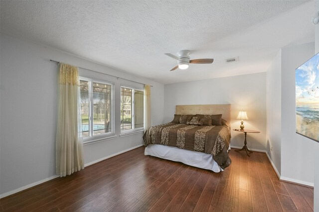 2711 N Saddlebrook Ln, Katy, TX 77494 - bedroom with baseboards, a ceiling fan, wood finished floors, and visible vents