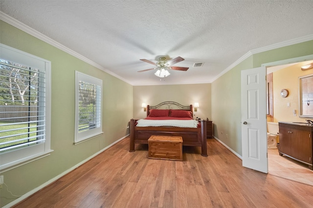 2711 N Saddlebrook Ln, Katy, TX 77494 - bedroom featuring crown molding, light wood finished floors, and visible vents