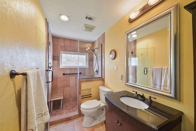 2711 N Saddlebrook Ln, Katy, TX 77494 - bathroom featuring visible vents, tile patterned flooring, vanity, toilet, and a shower stall