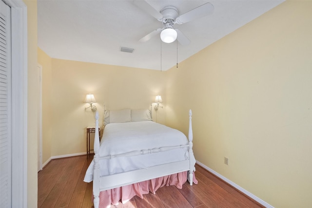 2711 N Saddlebrook Ln, Katy, TX 77494 - bedroom with visible vents, a ceiling fan, baseboards, and wood finished floors