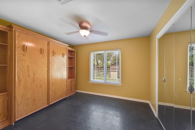 2711 N Saddlebrook Ln, Katy, TX 77494 - unfurnished bedroom with a closet, baseboards, ceiling fan, and visible vents