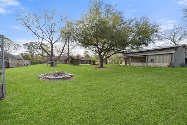 2711 N Saddlebrook Ln, Katy, TX 77494 - view of yard with fence and a fire pit