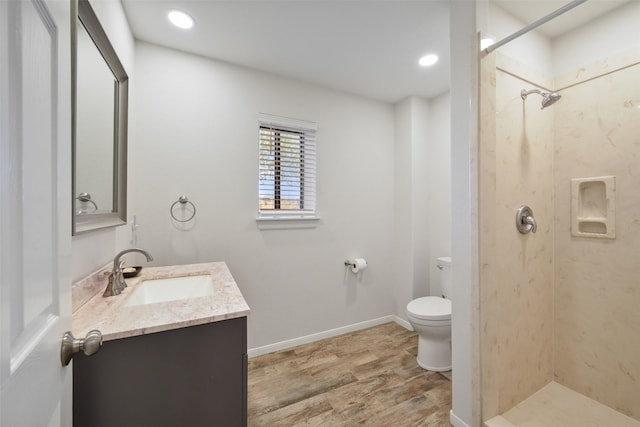2711 N Saddlebrook Ln, Katy, TX 77494 - full bath with toilet, walk in shower, wood finished floors, and vanity