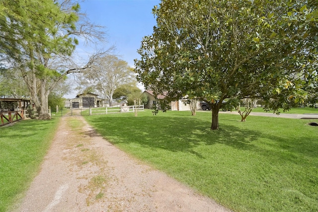 2711 N Saddlebrook Ln, Katy, TX 77494 - view of property's community featuring a lawn and fence