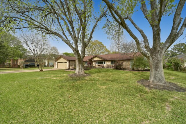 2711 N Saddlebrook Ln, Katy, TX 77494 - single story home with an attached garage, driveway, and a front yard