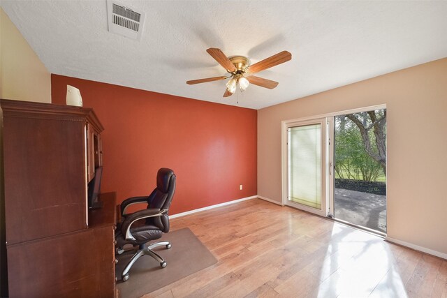2711 N Saddlebrook Ln, Katy, TX 77494 - unfurnished office featuring baseboards, ceiling fan, visible vents, and light wood-style flooring