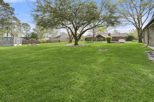 2711 N Saddlebrook Ln, Katy, TX 77494 - view of yard with fence, an outbuilding, and a greenhouse