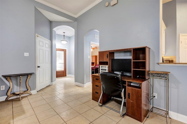 11542 Twain Dr, Montgomery, TX 77356 - home office with crown molding, arched walkways, baseboards, and light tile patterned floors