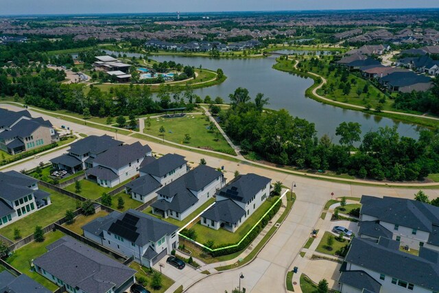 bird's eye view featuring a residential view and a water view