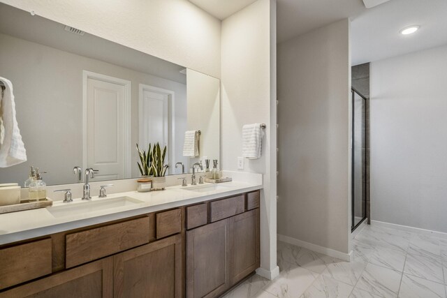 bathroom with a sink, visible vents, a stall shower, and marble finish floor