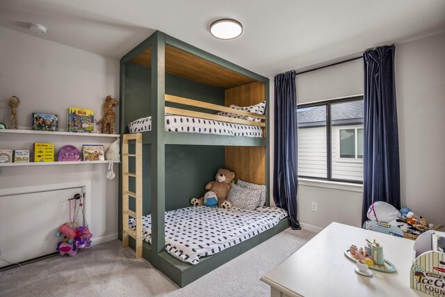 carpeted bedroom with baseboards
