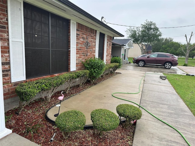 4060 Dubuque Pkwy, Rosharon, TX 77583 - view of home's exterior featuring brick siding and concrete driveway