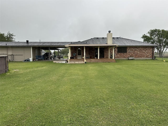 4060 Dubuque Pkwy, Rosharon, TX 77583 - back of house featuring a patio, a yard, and a chimney