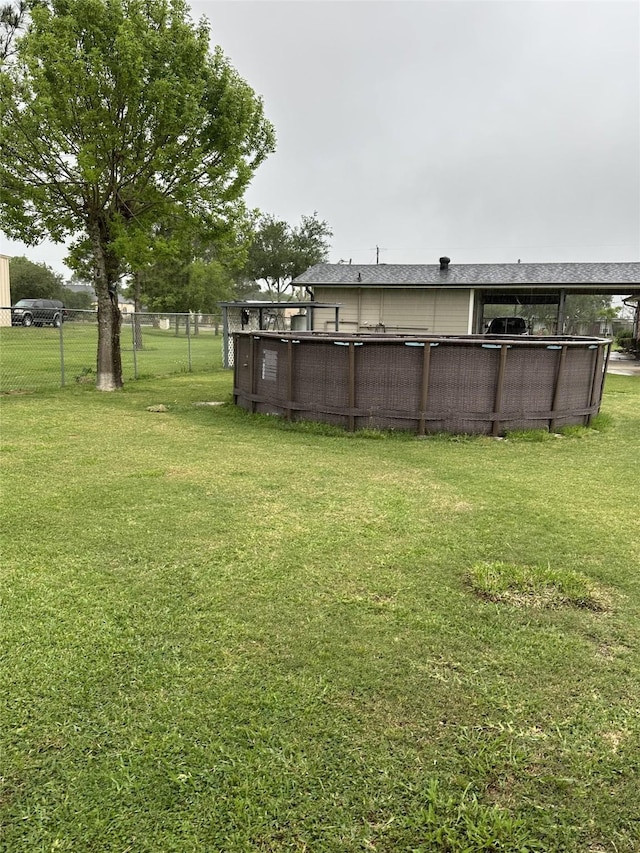 4060 Dubuque Pkwy, Rosharon, TX 77583 - view of yard featuring fence and an outdoor pool