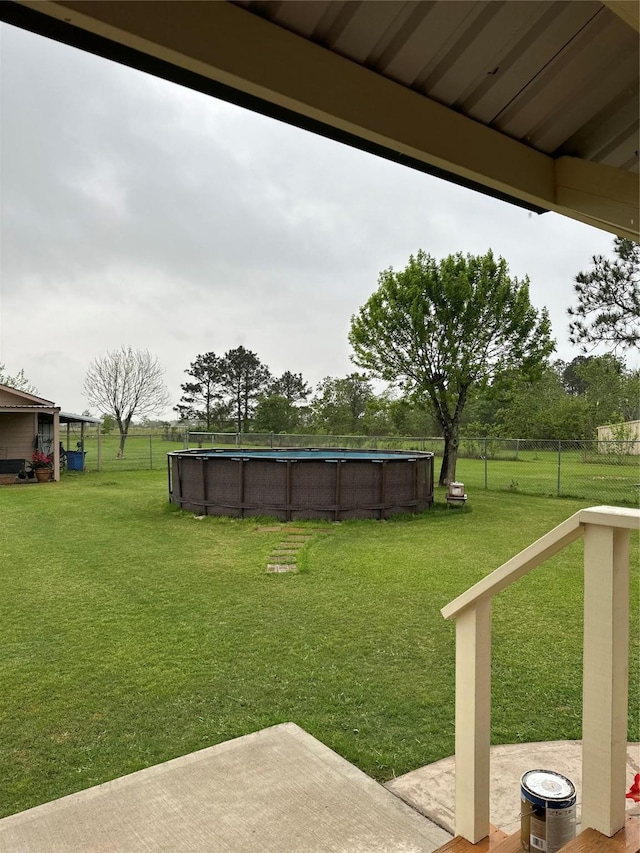4060 Dubuque Pkwy, Rosharon, TX 77583 - view of yard featuring fence, a patio area, and a fenced in pool