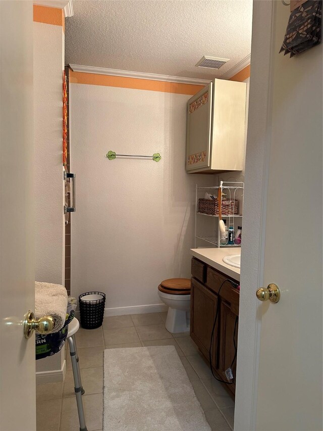 4060 Dubuque Pkwy, Rosharon, TX 77583 - bathroom featuring visible vents, tile patterned flooring, vanity, toilet, and ornamental molding
