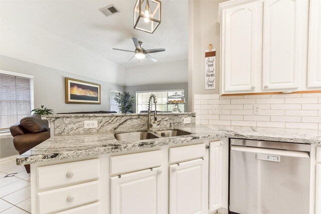 kitchen with stainless steel dishwasher, light stone countertops, ceiling fan, tasteful backsplash, and a sink
