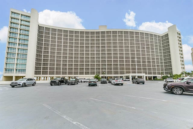view of property featuring uncovered parking