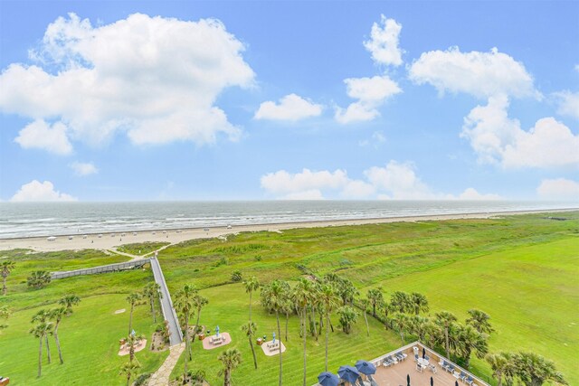 birds eye view of property featuring a water view and a view of the beach