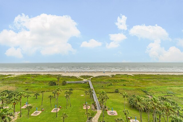 drone / aerial view featuring a view of the beach and a water view