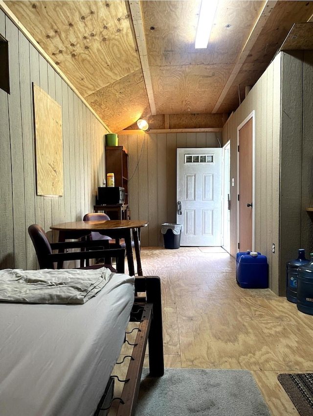 bedroom with wood walls
