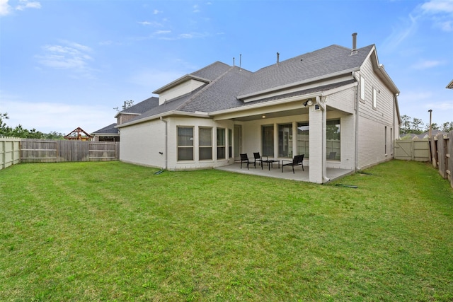 back of house with a fenced backyard, a shingled roof, a patio area, and brick siding