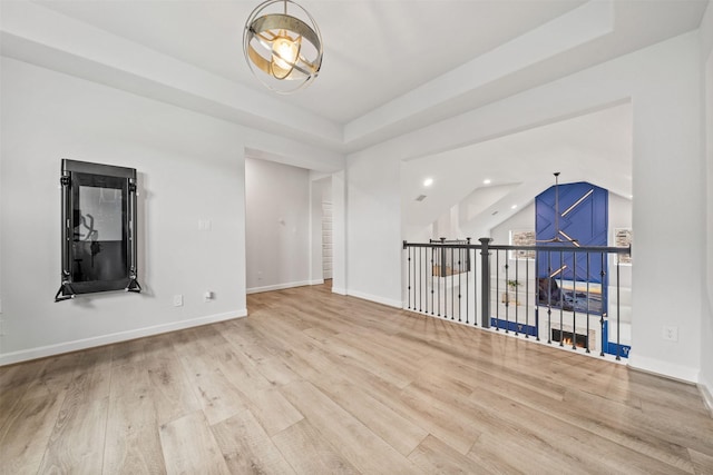 empty room with recessed lighting, baseboards, and wood finished floors