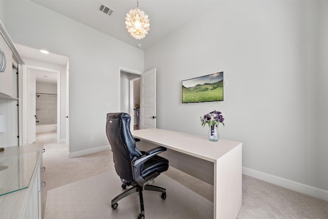 office featuring an inviting chandelier, baseboards, light carpet, and visible vents