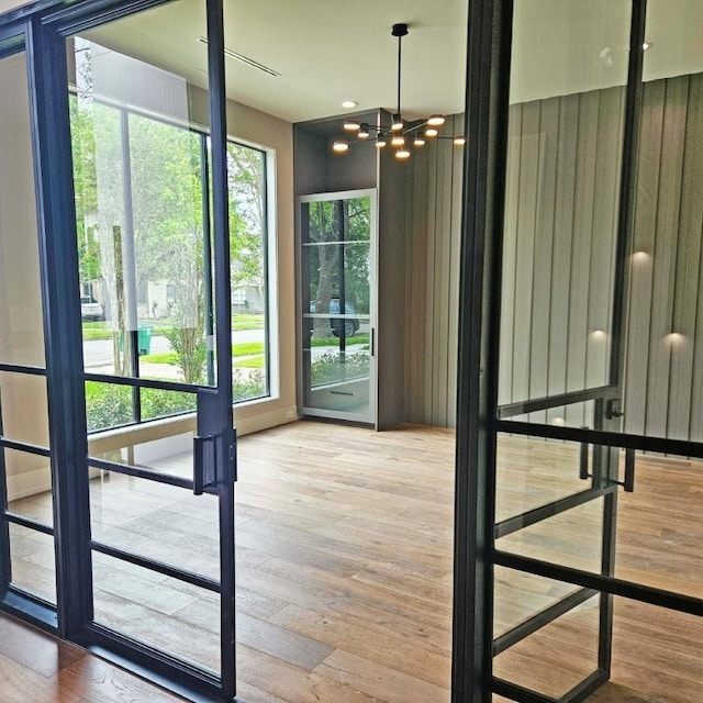 1014 Gardenia Dr, Houston, TX 77018 - entryway featuring a wealth of natural light, an inviting chandelier, and wood finished floors